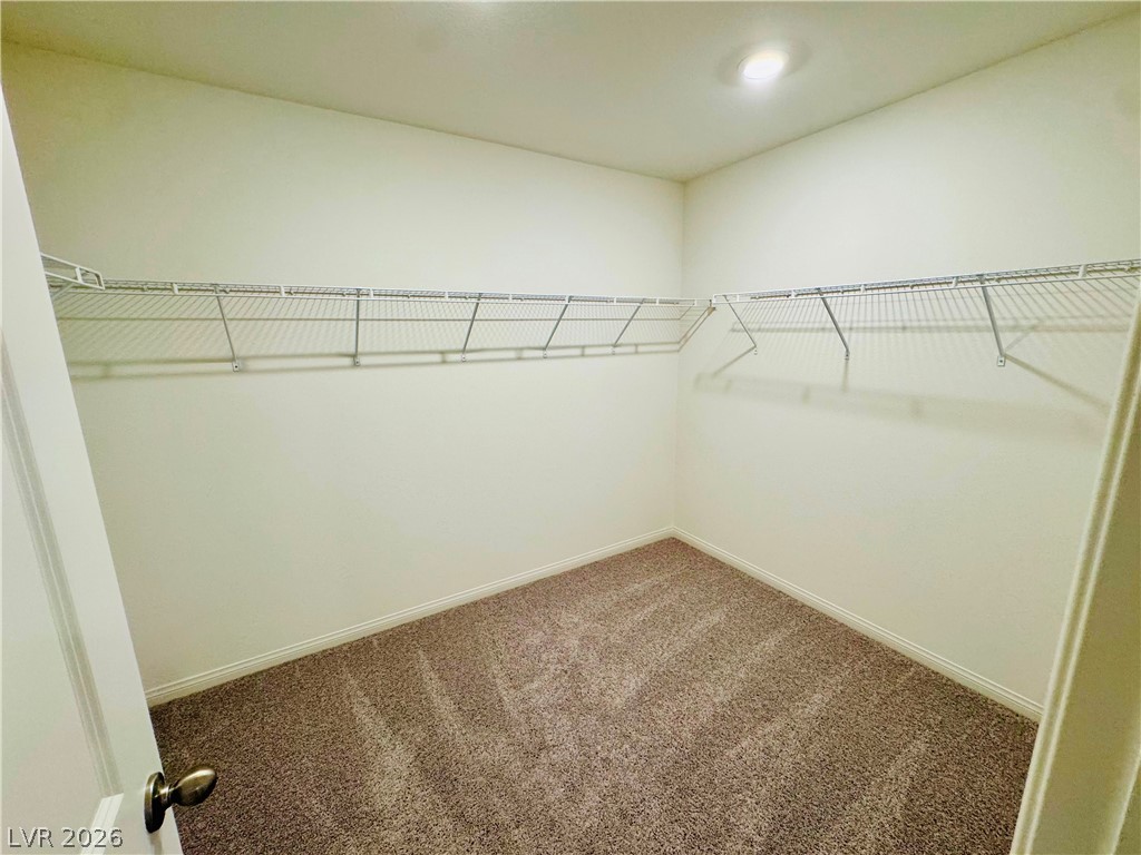 9249 Innot Avenue Las Vegas, NV 89148 - Photo 18 of 24 Ample shelving within a generously sized closet provides versatile storage solutions.