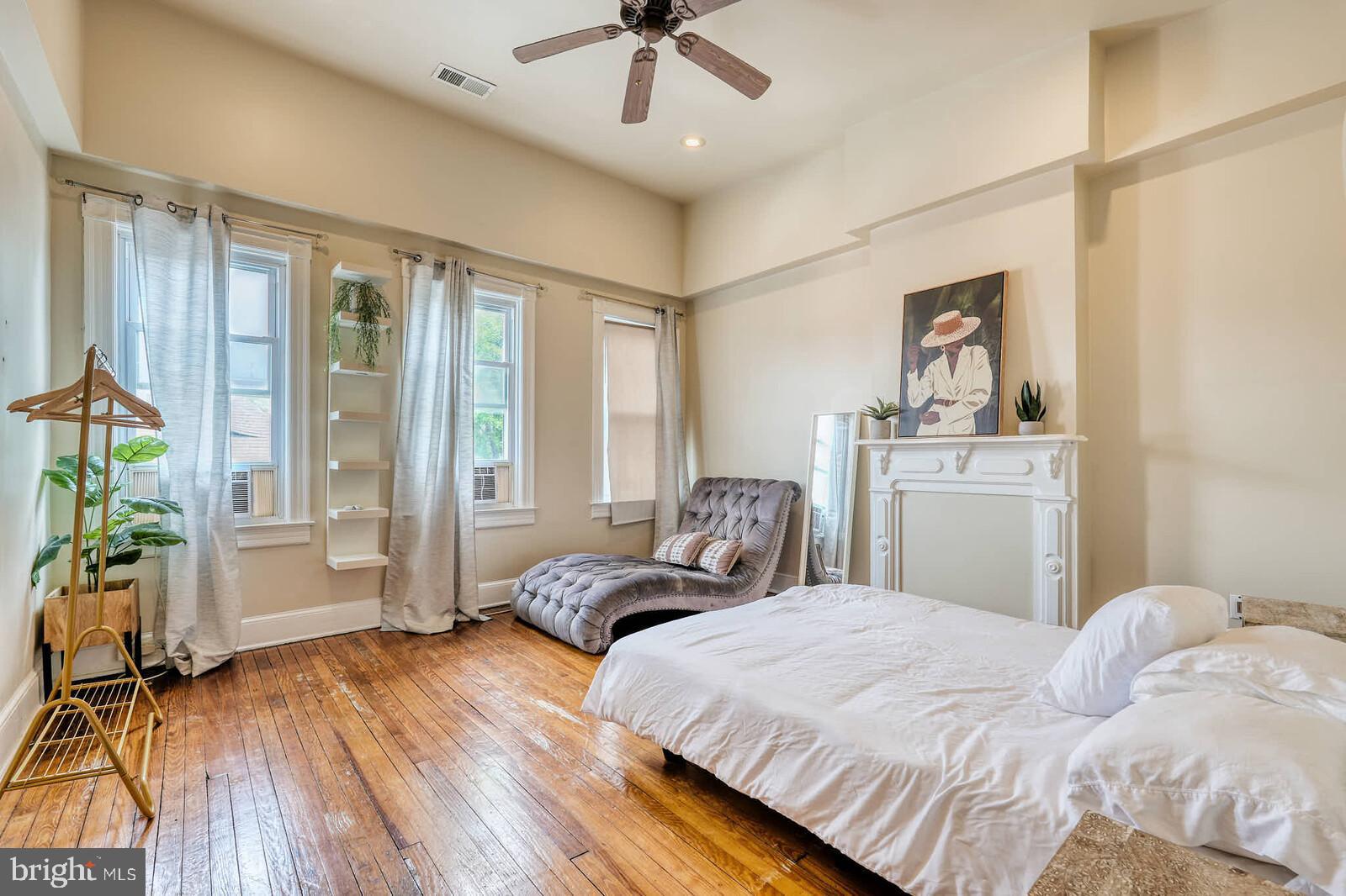 1402 Light Street Baltimore, MD 21230 - Photo 21 of 60 a bedroom with a bed and glass door