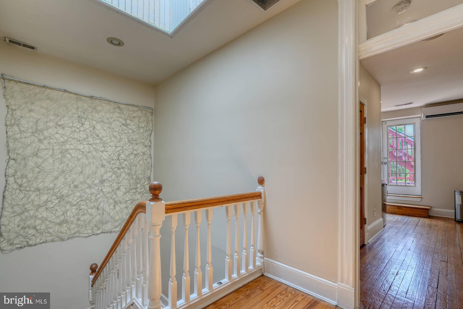 1402 Light Street Baltimore, MD 21230 - Photo 24 of 60 a view of a hallway view with wooden floor and staircase
