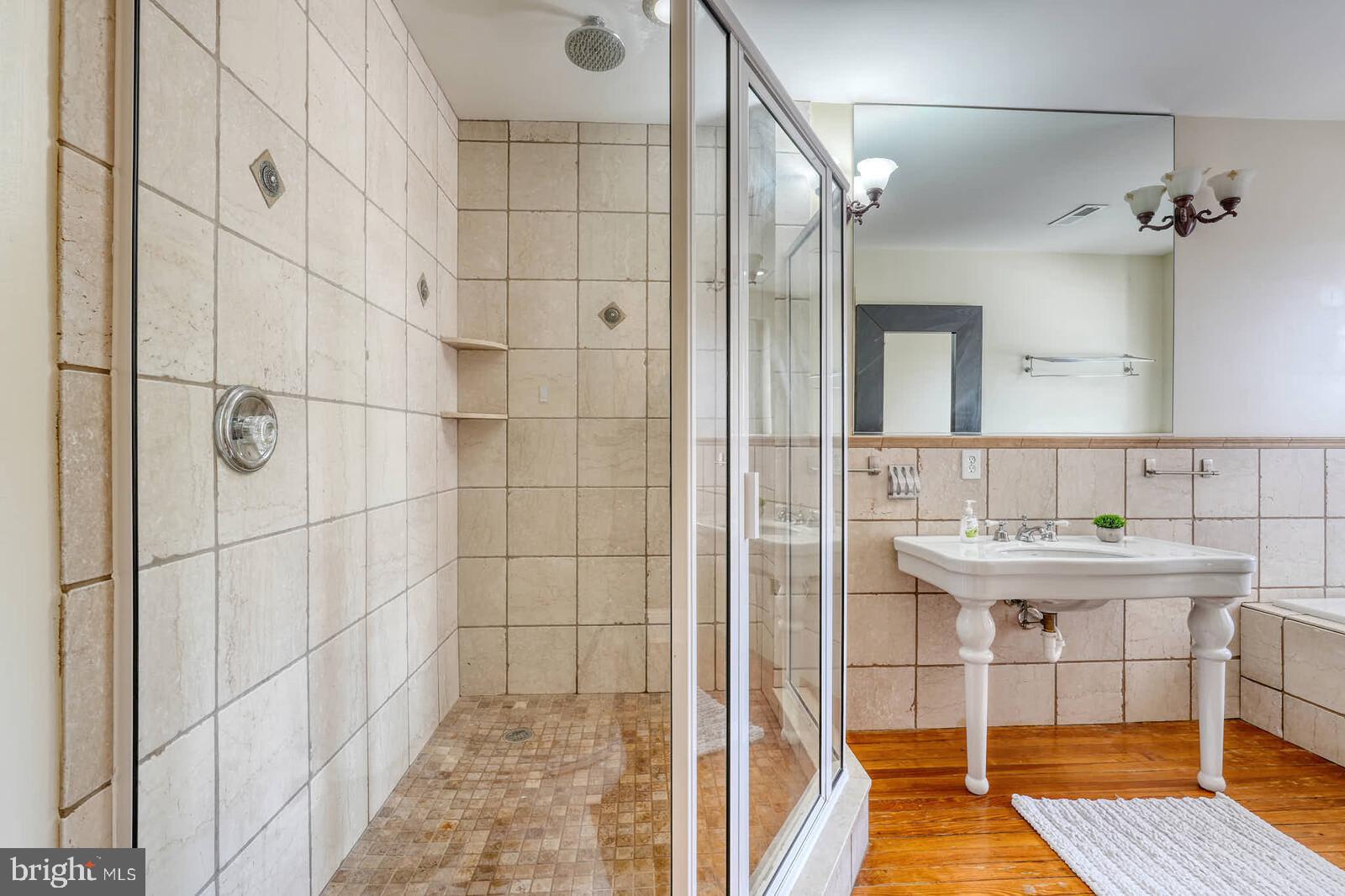 1402 Light Street Baltimore, MD 21230 - Photo 28 of 60 a bathroom with a sink and a mirror