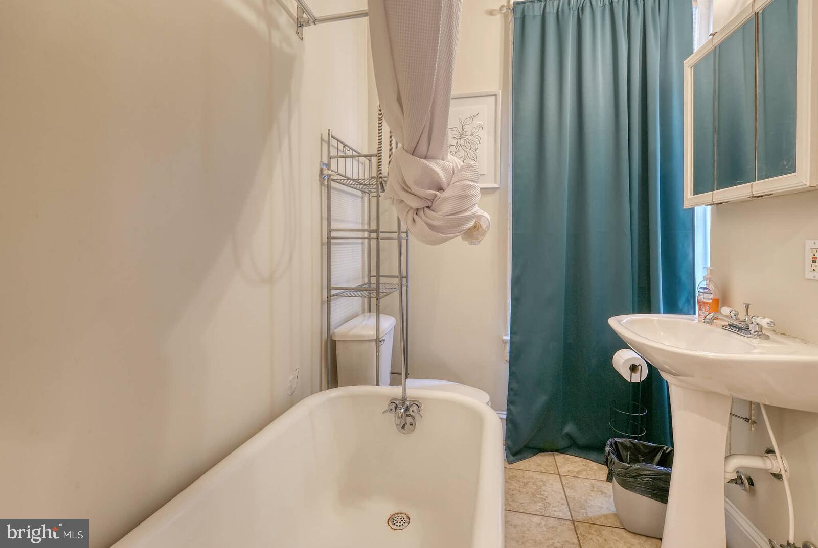 1402 Light Street Baltimore, MD 21230 - Photo 37 of 60 a bathroom with a sink and a mirror
