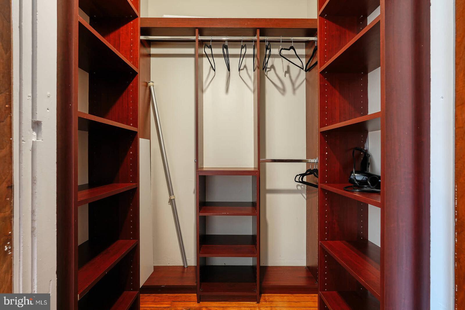 1402 Light Street Baltimore, MD 21230 - Photo 41 of 60 a view of walk in closet with clothes and shoes