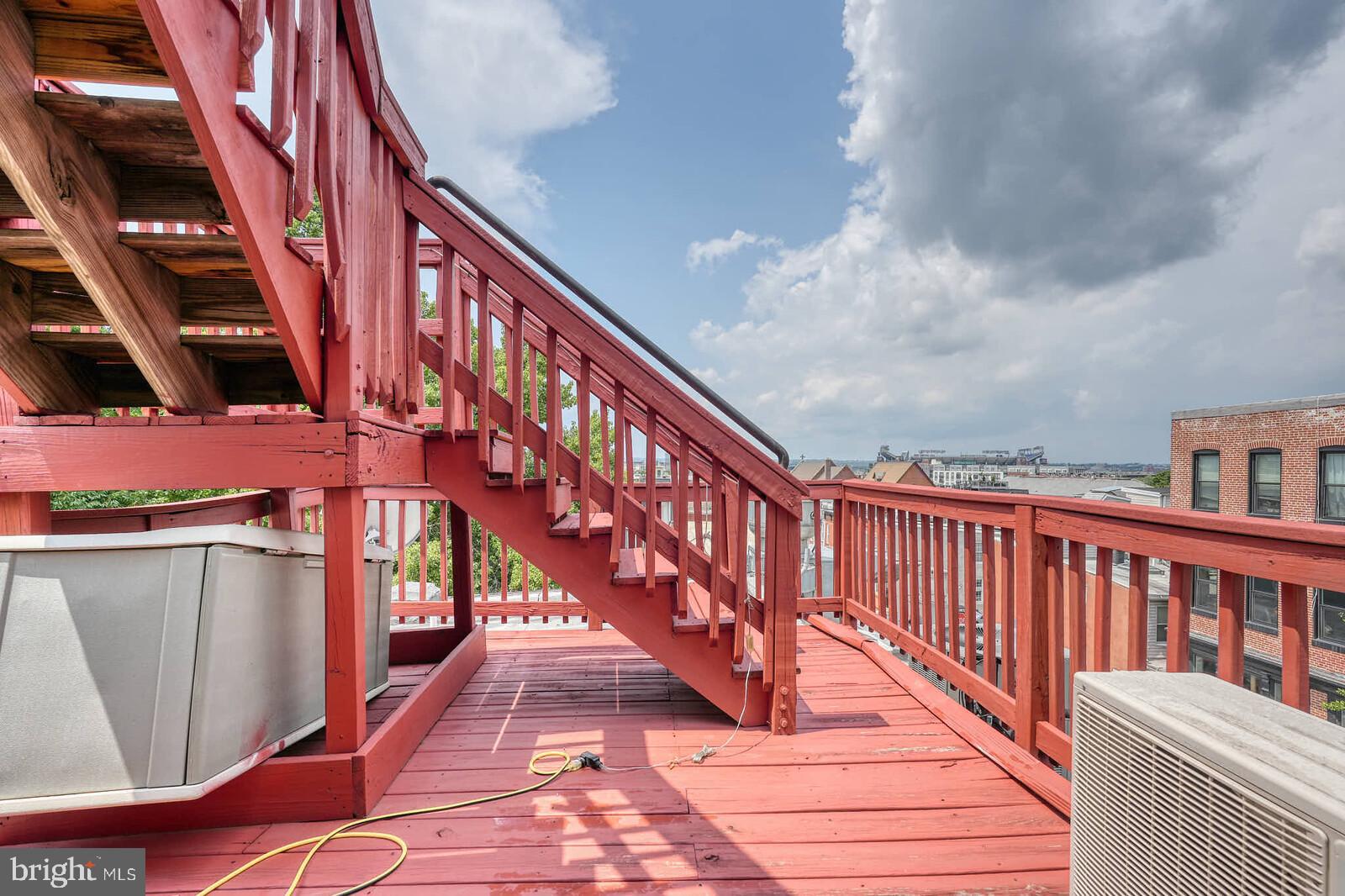 1402 Light Street Baltimore, MD 21230 - Photo 54 of 60 a balcony with wooden floor