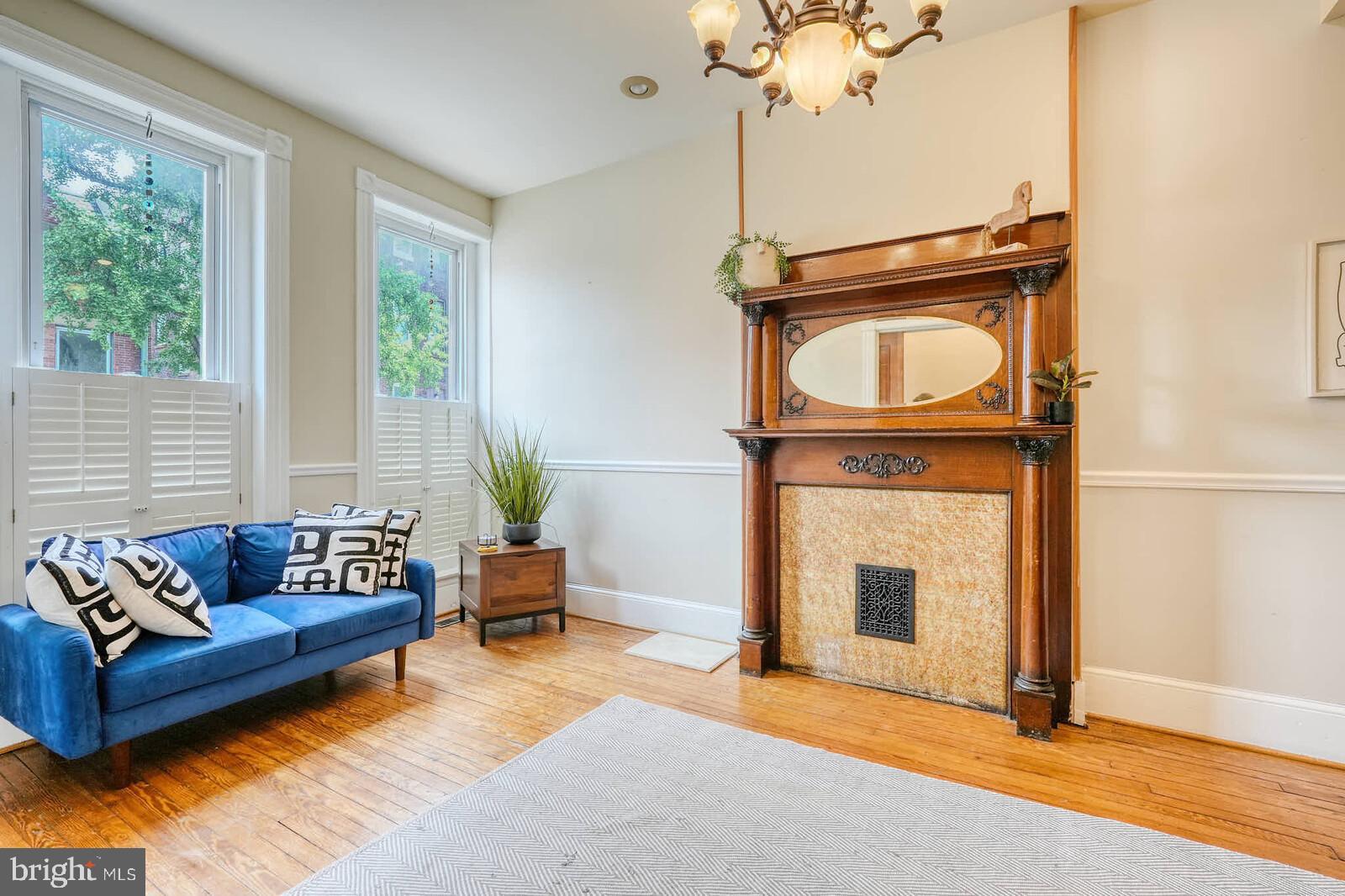 1402 Light Street Baltimore, MD 21230 - Photo 7 of 60 a living room with furniture and a fireplace