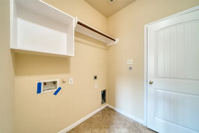 a view of a hallway with wooden floor and windows