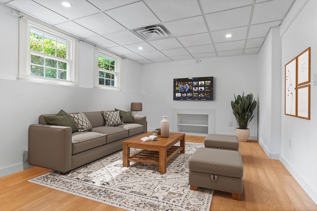 94 Codman Road Lincoln, MA 01773 - Photo 14 of 22 a living room with furniture and a potted plant