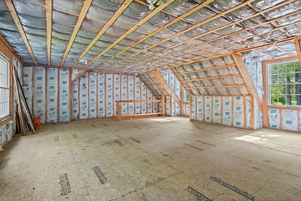 94 Codman Road Lincoln, MA 01773 - Photo 19 of 22 a view of an empty room with a staircase