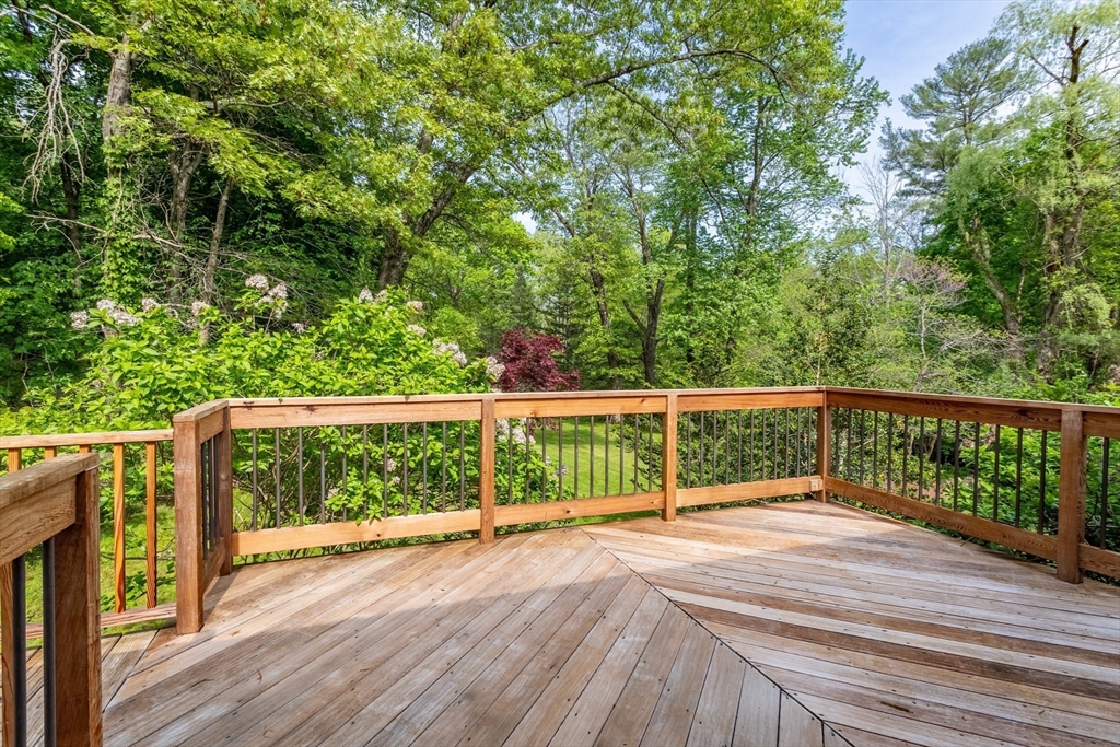 94 Codman Road Lincoln, MA 01773 - Photo 3 of 22 a view of balcony with wooden floor and fence