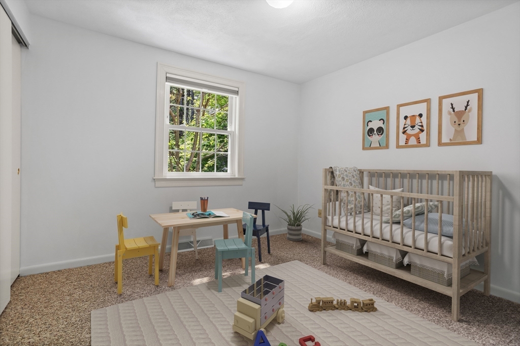 94 Codman Road Lincoln, MA 01773 - Photo 10 of 22 a bedroom with furniture and a window