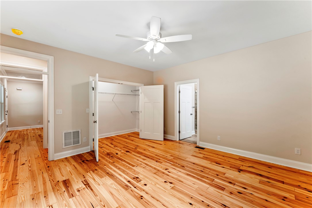 110 Gabriel Way Pickens, SC 29671 - Photo 18 of 48 Hardwood floors and a ceiling fan create a comfortable and inviting bedroom atmosphere.