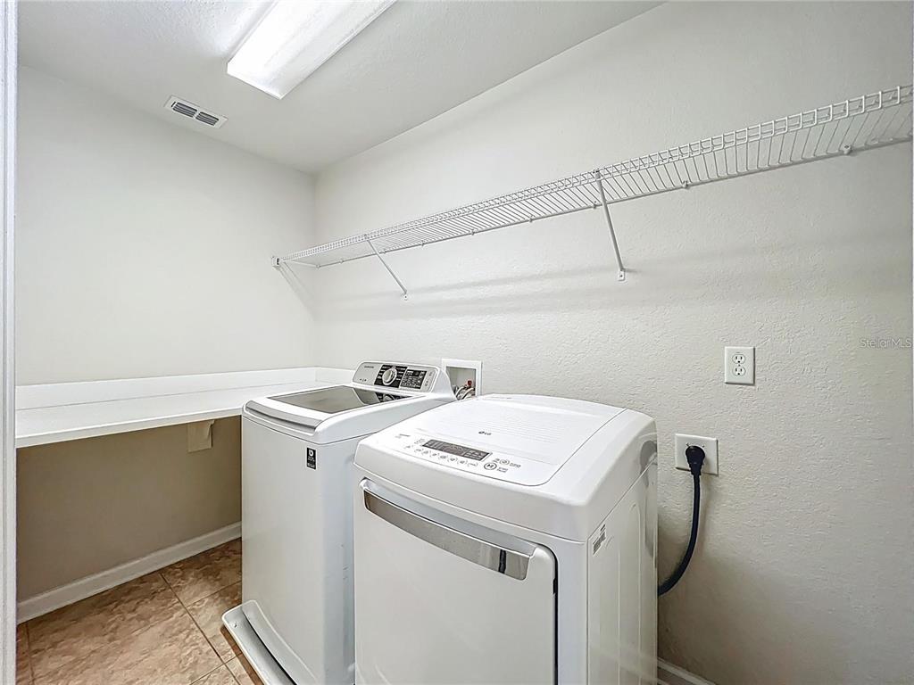 13225 Charfield Street Windermere, FL 34786 - Photo 37 of 40 a utility room with dryer and washer