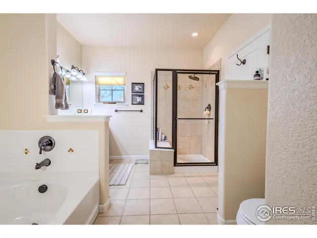 a view of a chair and tables in the balcony