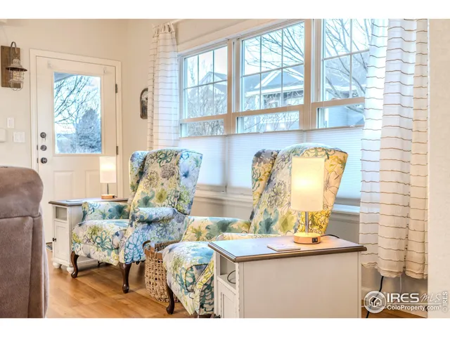 a kitchen with stainless steel appliances kitchen island granite countertop a sink a stove and a refrigerator