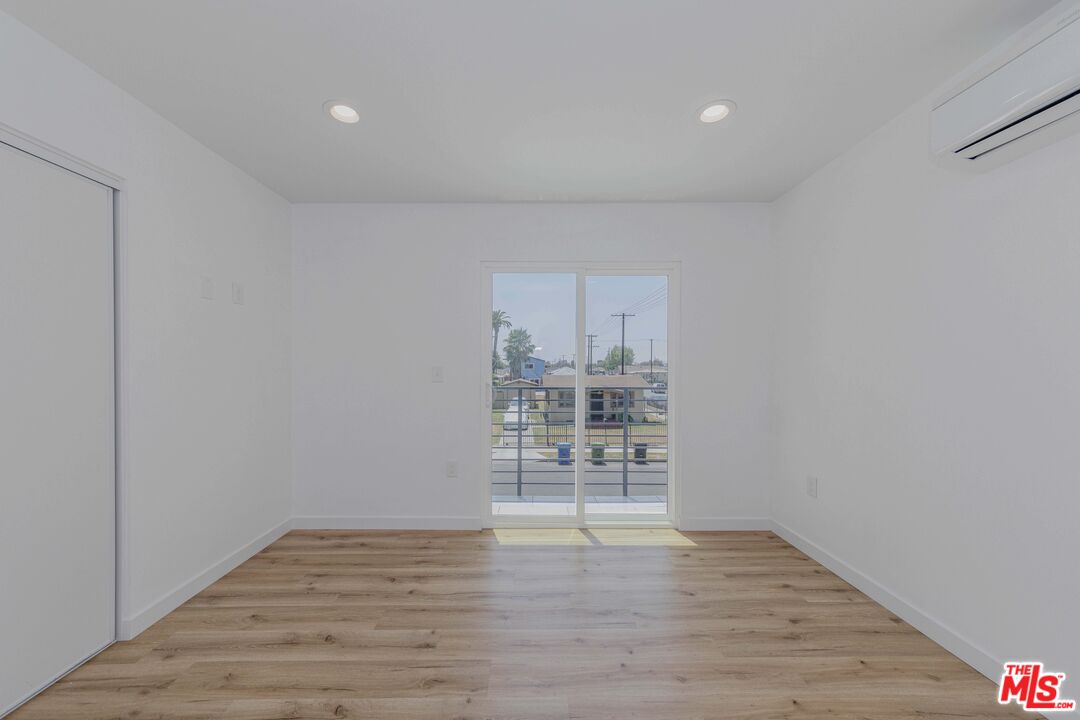 1105 East 103rd Place Los Angeles, CA 90002 - Photo 23 of 56 a view of a livingroom with wooden floor