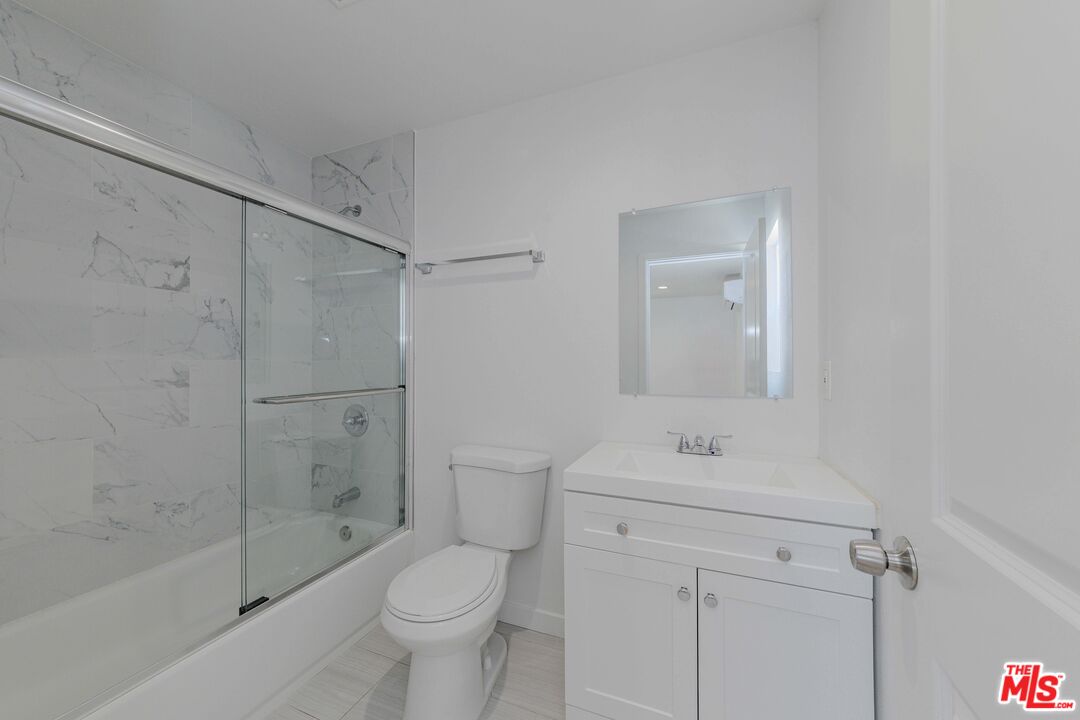 1105 East 103rd Place Los Angeles, CA 90002 - Photo 47 of 56 a bathroom with a sink toilet and shower