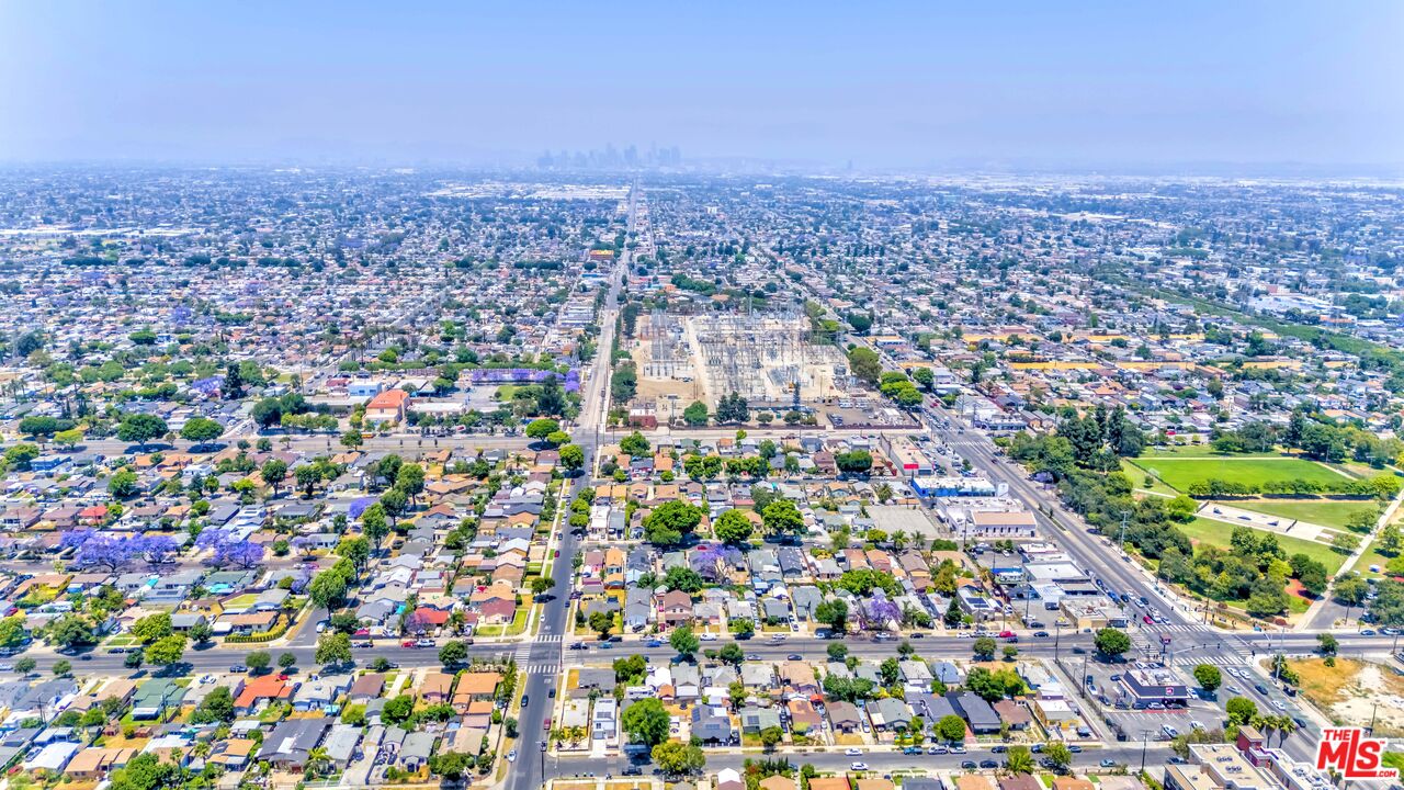 1105 East 103rd Place Los Angeles, CA 90002 - Photo 55 of 56 an aerial view of a city with lots of residential buildings