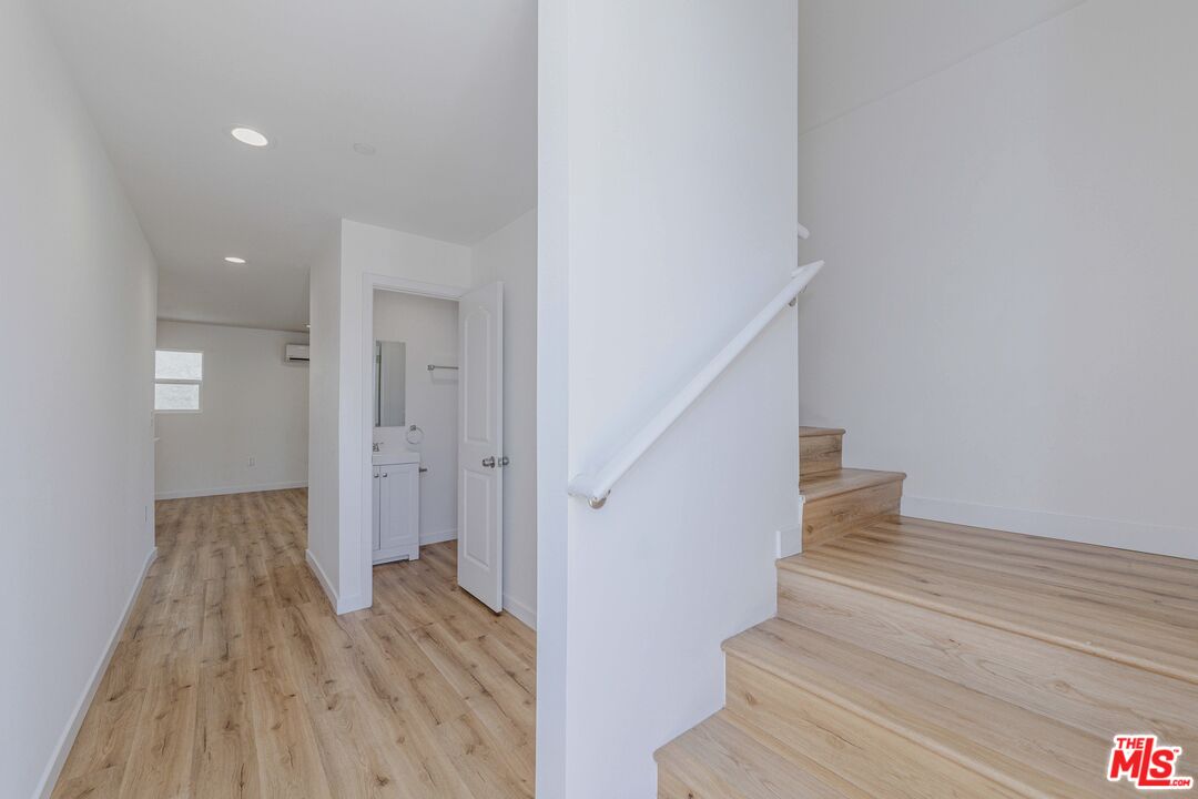 1105 East 103rd Place Los Angeles, CA 90002 - Photo 10 of 56 a view of entryway with wooden floor