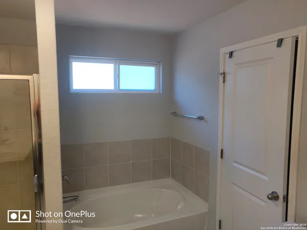 a bath tub sitting next to a window