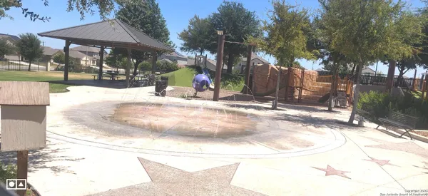 a room with gym equipment and large windows