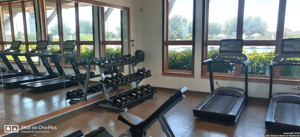 a view of a backyard with sitting area