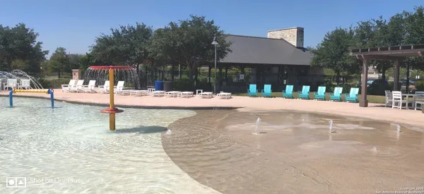 a view of balcony with chairs and umbrella
