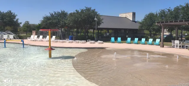 a view of balcony with chairs and umbrella