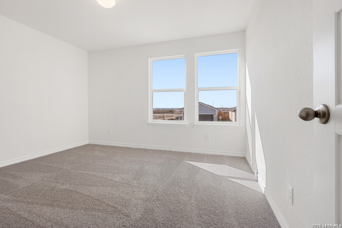 10045 Jagger Avenue Converse, TX 78109 - Photo 25 of 28 a view of an empty room with a window