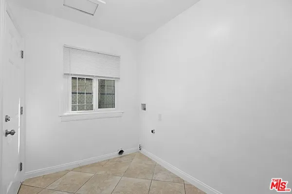 a view of an empty room with windows