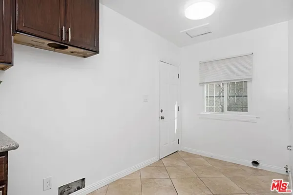 a view of a livingroom with an empty space and window