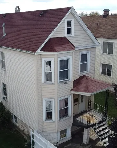 a view of a house with a tub and a table