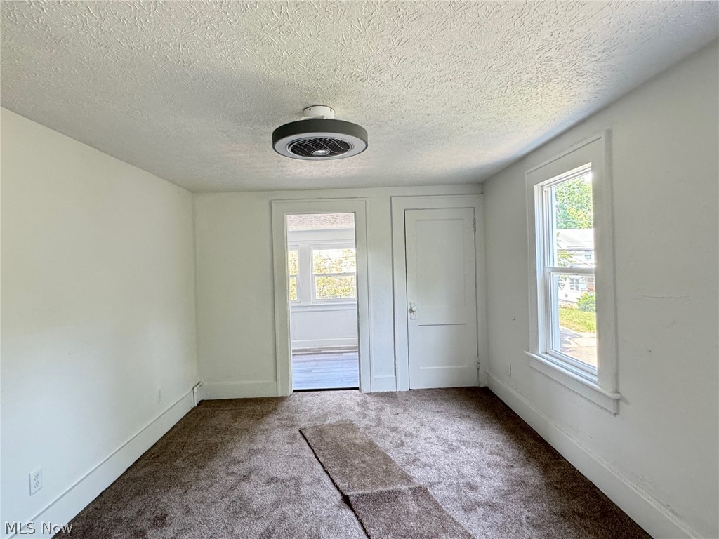 459 Patterson Avenue Akron, OH 44310 - Photo 7 of 24 2nd floor apt. Carpeted spare room with a textured ceiling and plenty of natural light