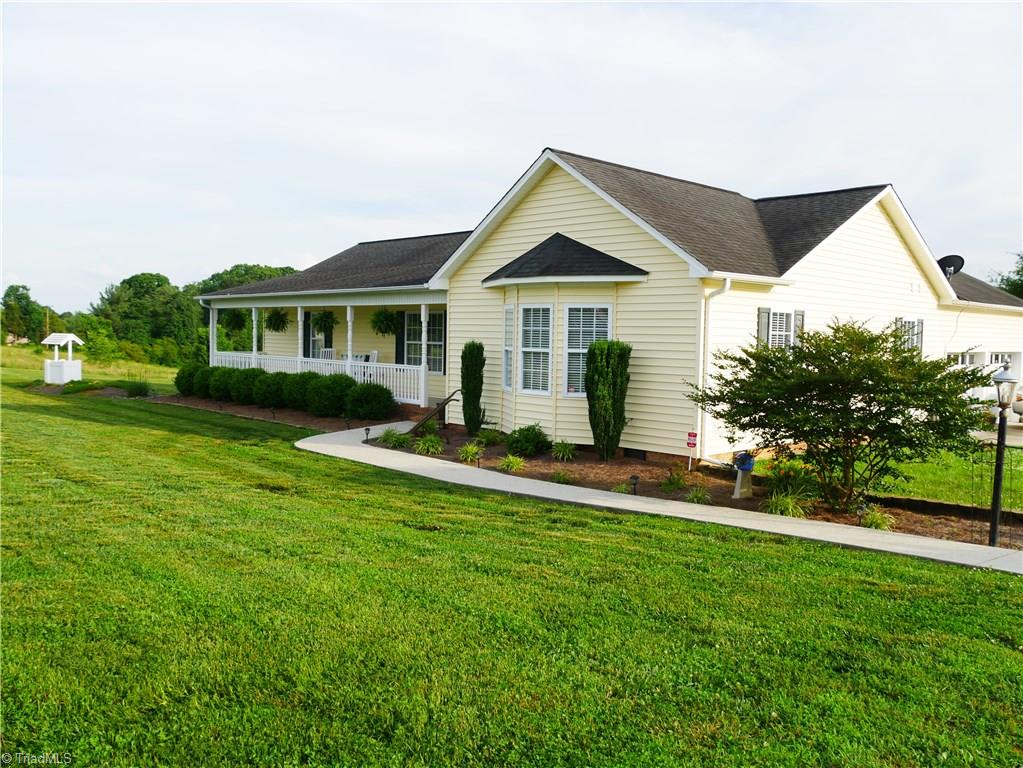 1615 Rosebud Road Walnut Cove, NC 27052 - Photo 1 of 20 Ranch Home. Corian Countertops, Storage Building, Veka Deck, 2 car garage with cabinets, Veka Decking on Deck, Alarm System, Taexx Built in Pest Control System (fee)
