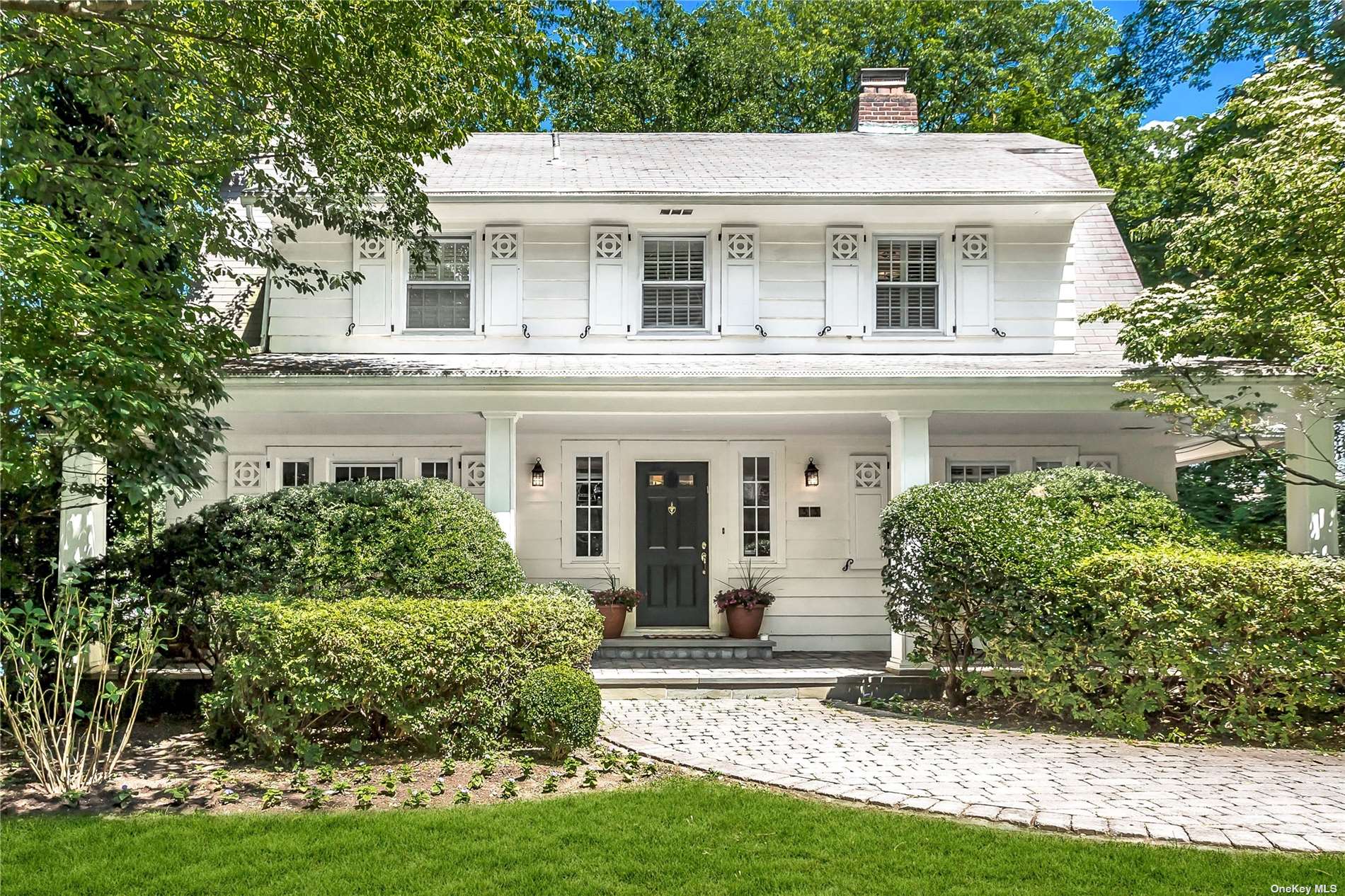 33 Windsor Road Great Neck, NY 11021 - Photo 1 of 1 a front view of a house with a yard