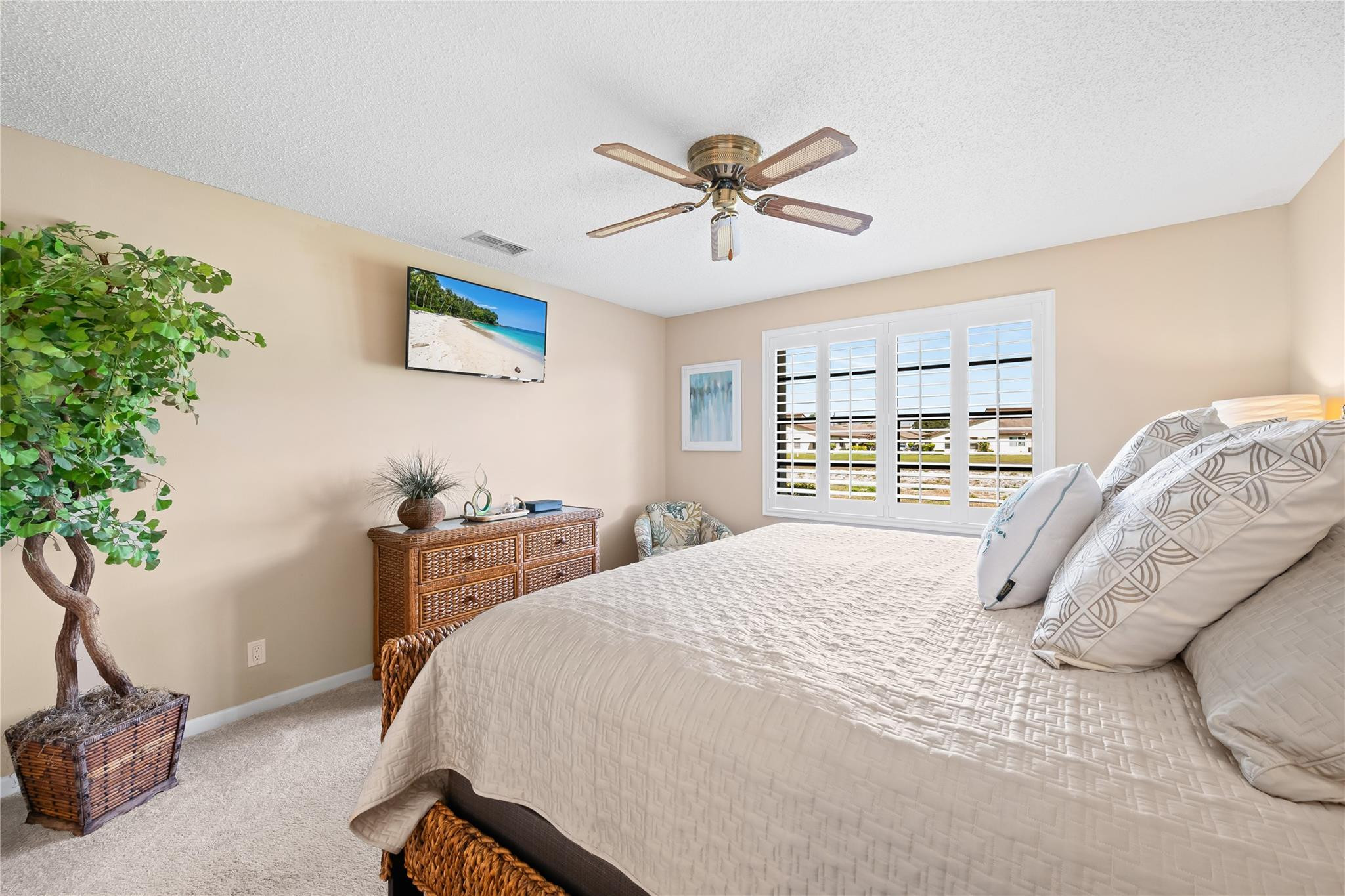 14067 Nesting Way, Unit C Delray Beach, FL 33484 - Photo 19 of 32 a bedroom with a bed and a window