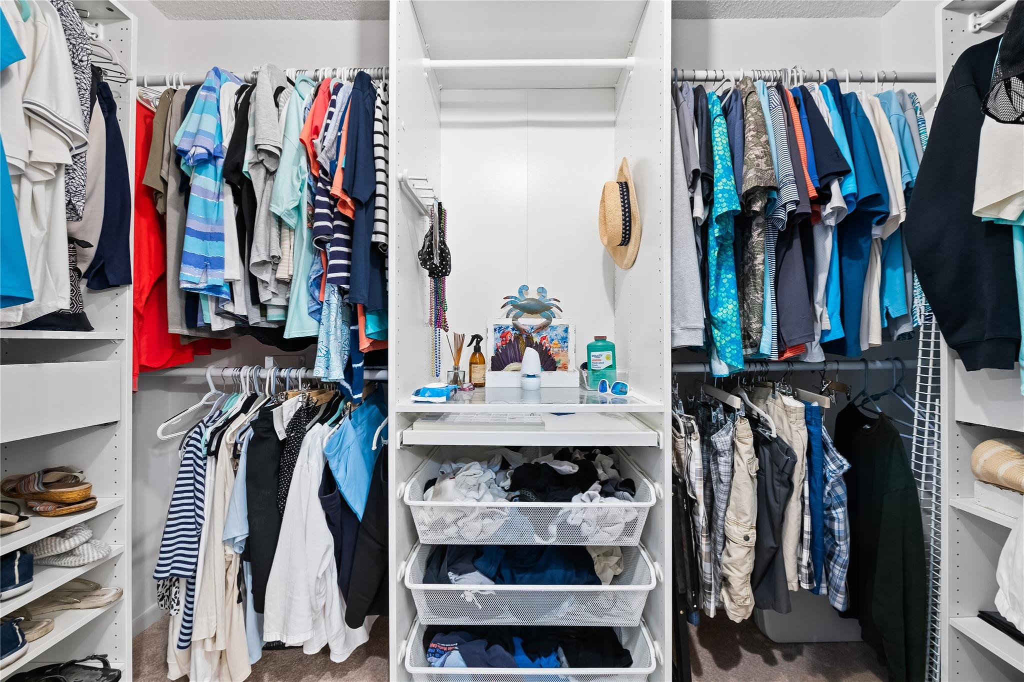 14067 Nesting Way, Unit C Delray Beach, FL 33484 - Photo 20 of 32 a view of walk in closet with clothes and shoes