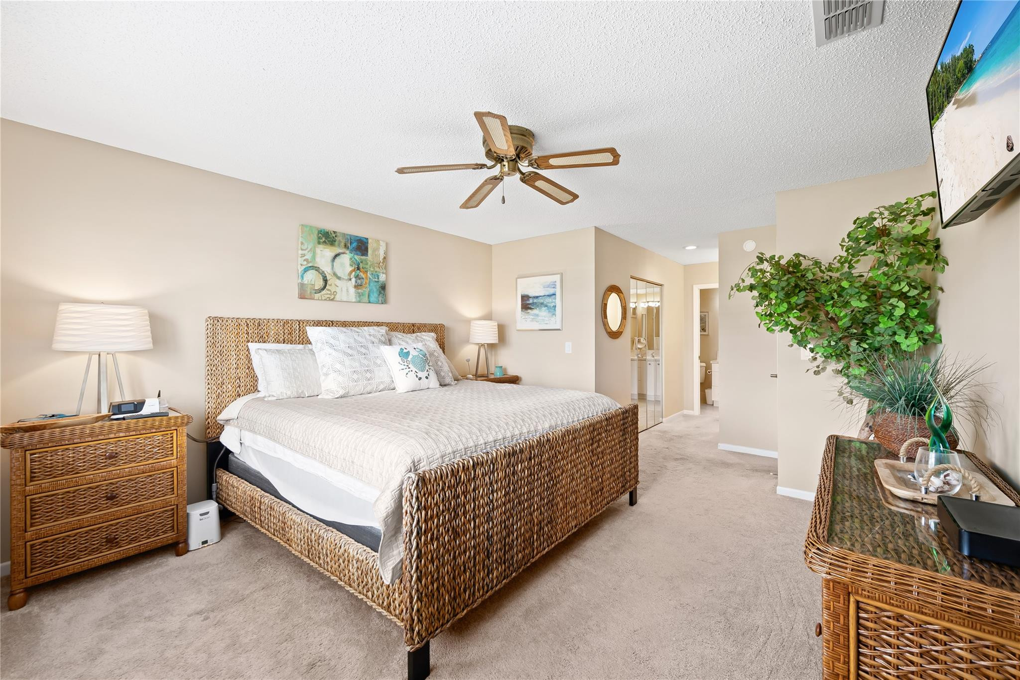 14067 Nesting Way, Unit C Delray Beach, FL 33484 - Photo 23 of 32 a bedroom with a bed and a chandelier