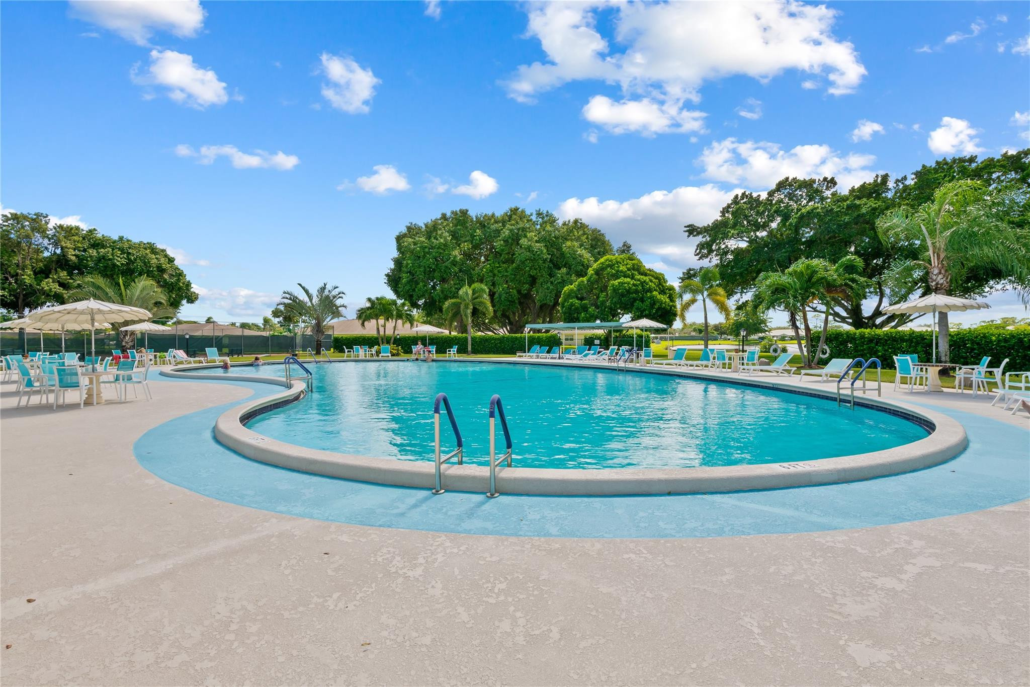 14067 Nesting Way, Unit C Delray Beach, FL 33484 - Photo 26 of 32 a view of a swimming pool with a yard