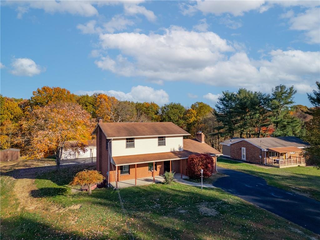 304 West Starz Road Cheswick, PA 15024 - Photo 1 of 48 a aerial view of a house with swimming pool and a yard