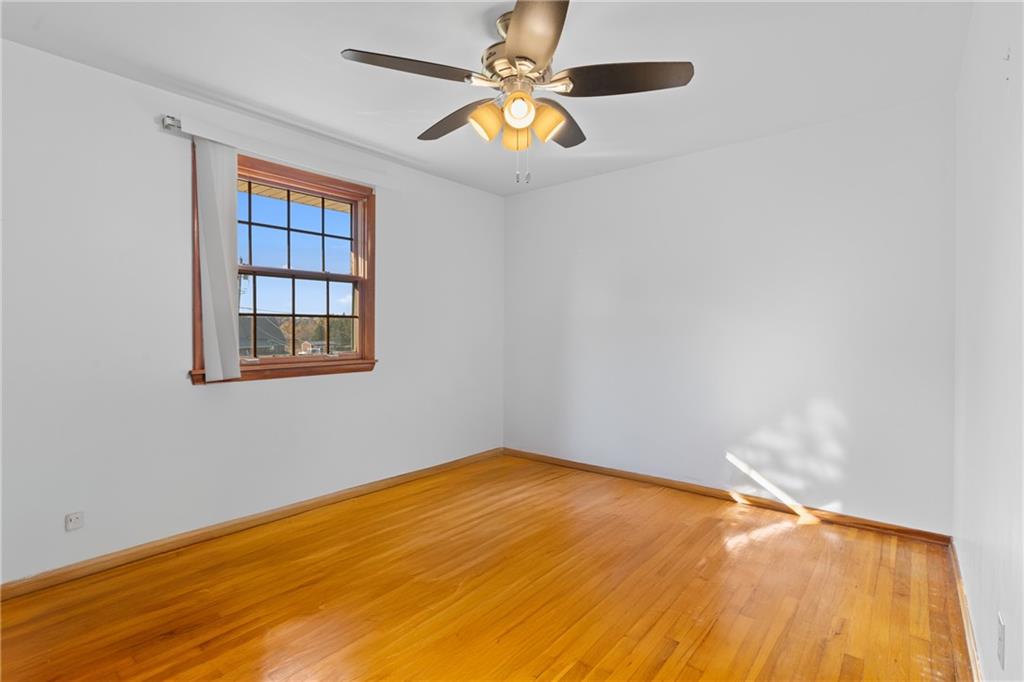 304 West Starz Road Cheswick, PA 15024 - Photo 18 of 48 a view of an empty room with window and chandelier fan