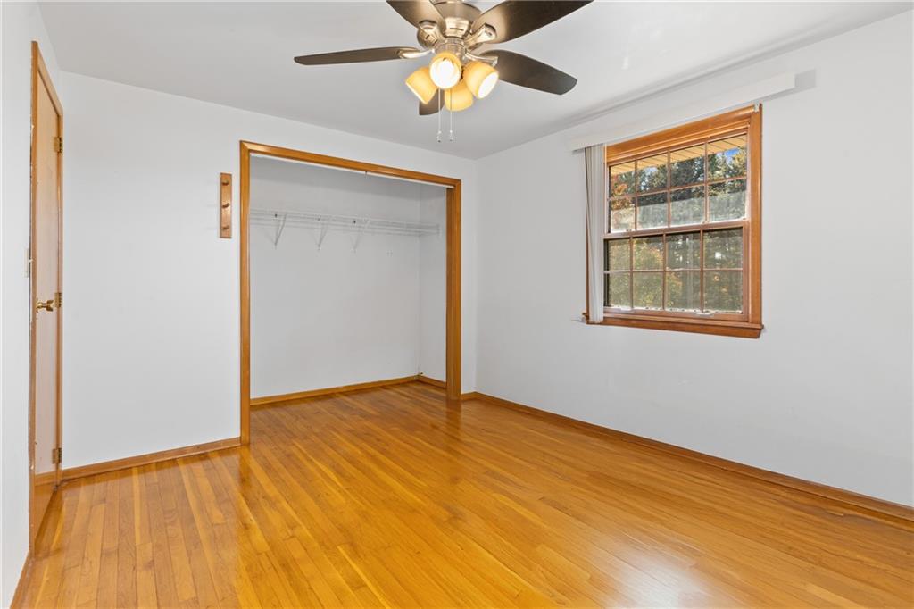 304 West Starz Road Cheswick, PA 15024 - Photo 19 of 48 a view of an empty room with window and wooden floor