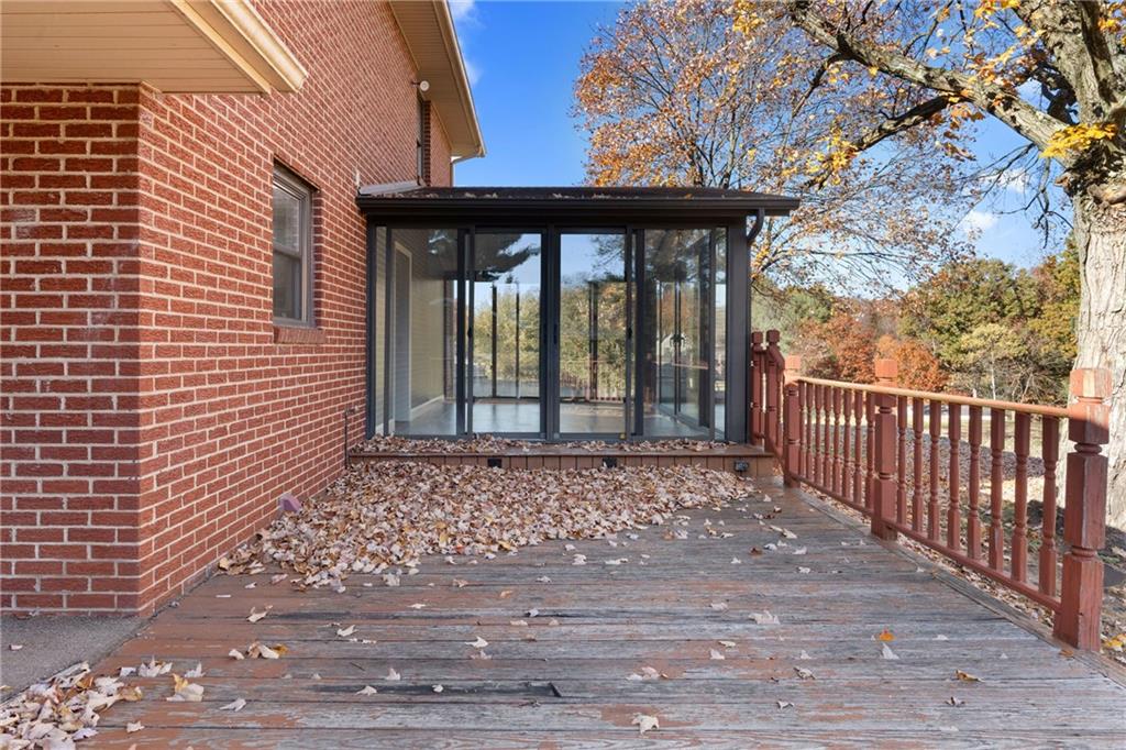304 West Starz Road Cheswick, PA 15024 - Photo 42 of 48 a view of a brick house with large windows