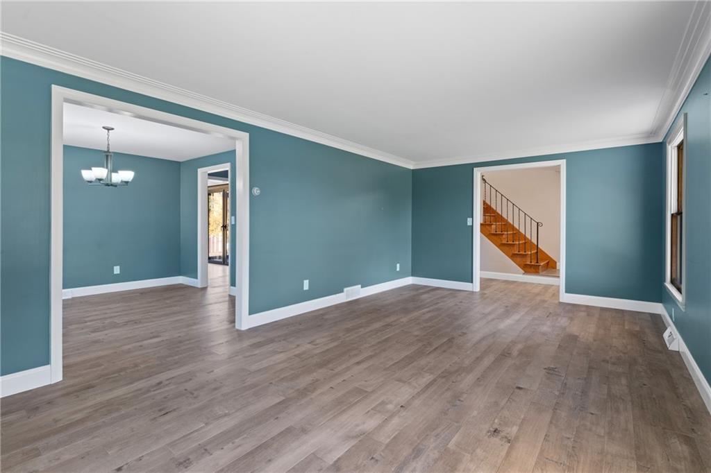 304 West Starz Road Cheswick, PA 15024 - Photo 5 of 48 an empty room with wooden floor & windows