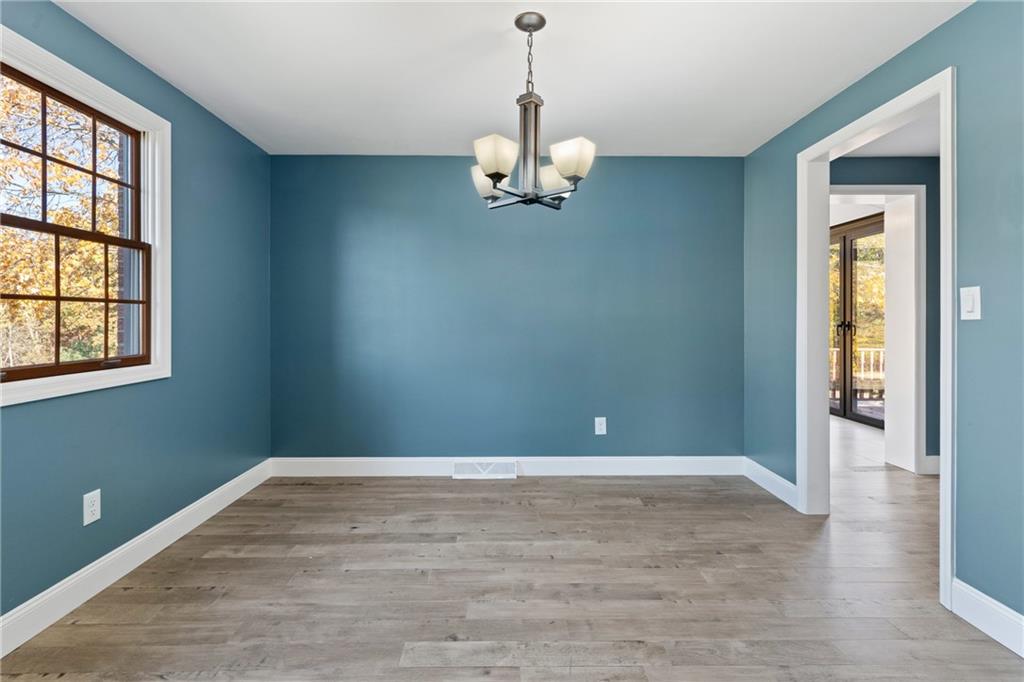 304 West Starz Road Cheswick, PA 15024 - Photo 6 of 48 wooden floor in an empty room with a window