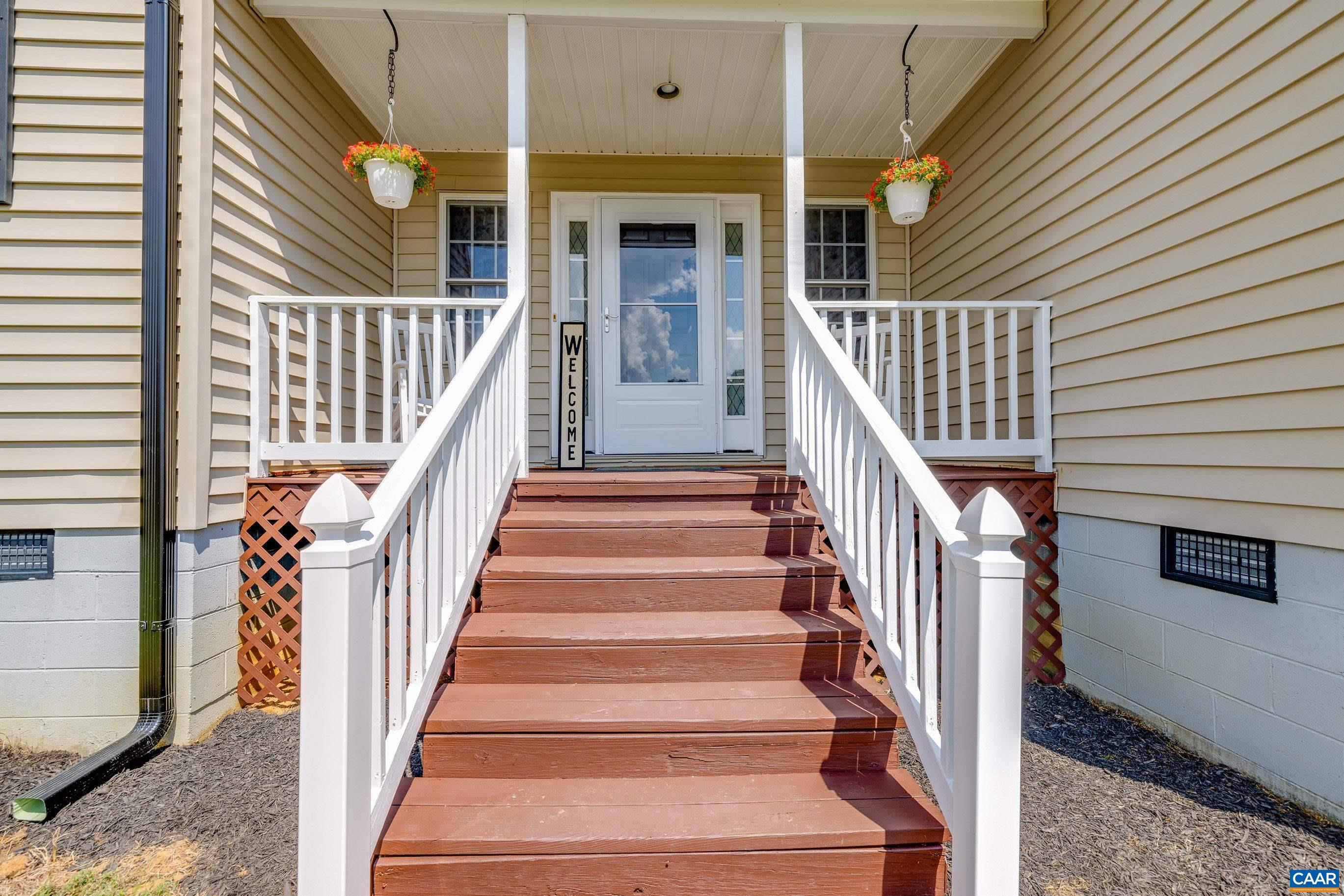 7839 Venable Road Kents Store, VA 23084 - Photo 11 of 51 a view of staircase with railing and white walls