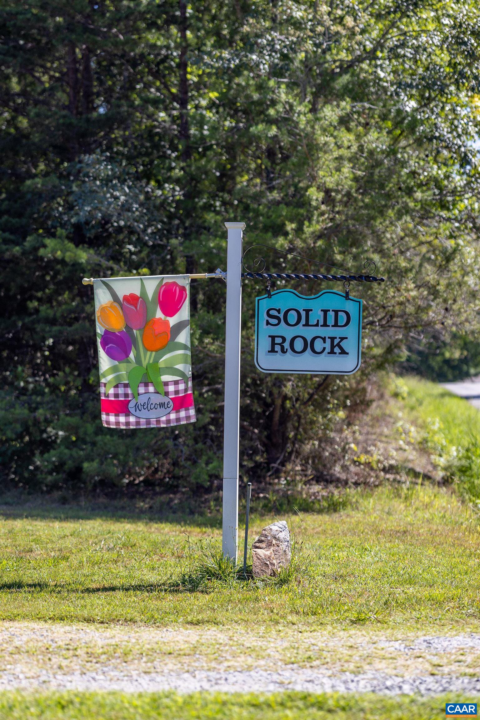 7839 Venable Road Kents Store, VA 23084 - Photo 2 of 51 a sign that is on the side of a road