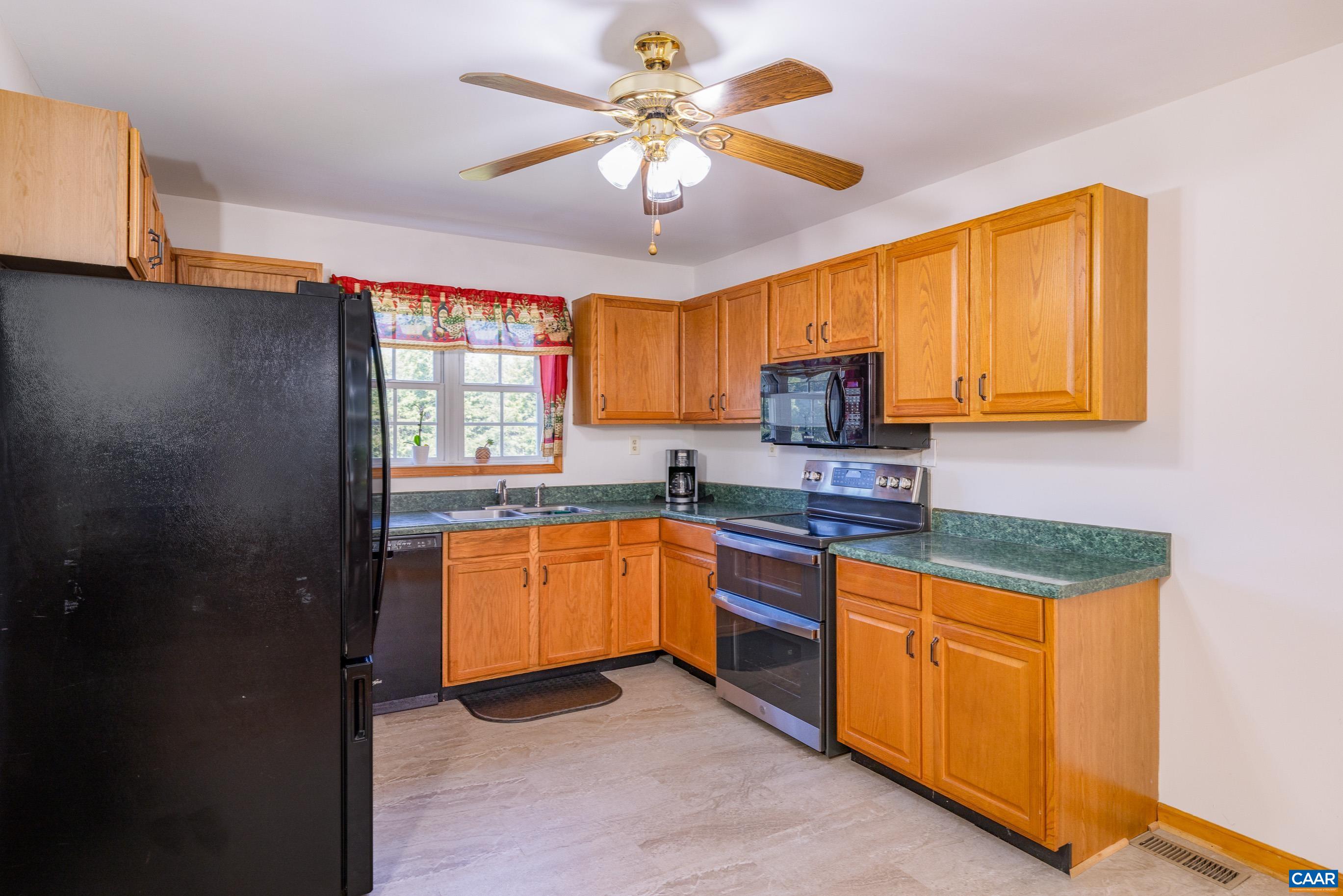 7839 Venable Road Kents Store, VA 23084 - Photo 22 of 51 a kitchen with granite countertop cabinets and window