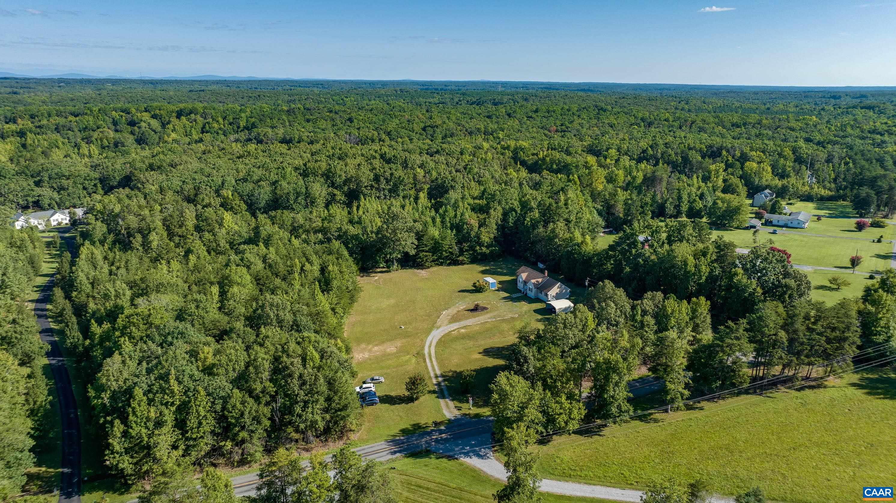 7839 Venable Road Kents Store, VA 23084 - Photo 3 of 51 a view of a lake with a city