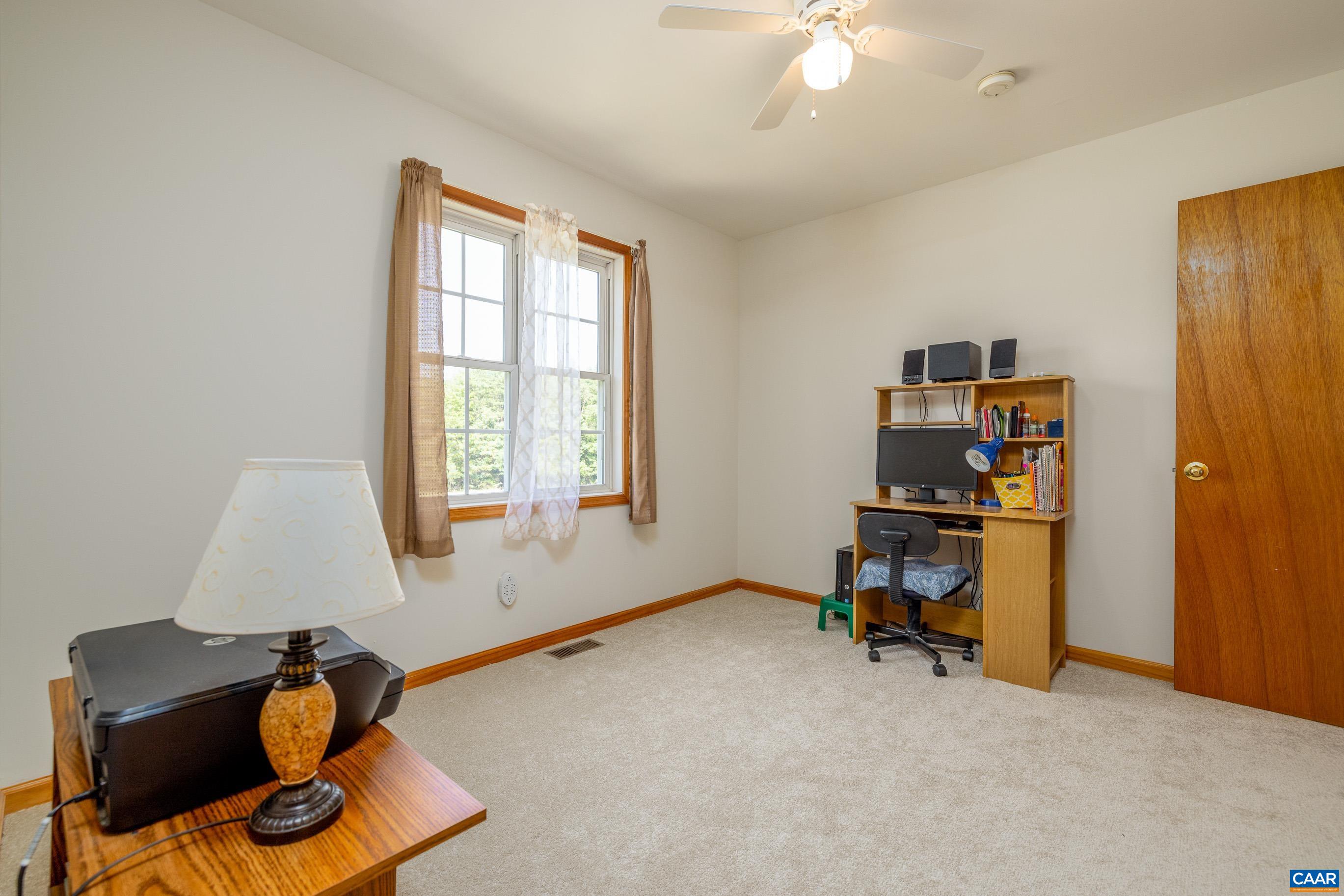 7839 Venable Road Kents Store, VA 23084 - Photo 31 of 51 a living room with furniture and a window