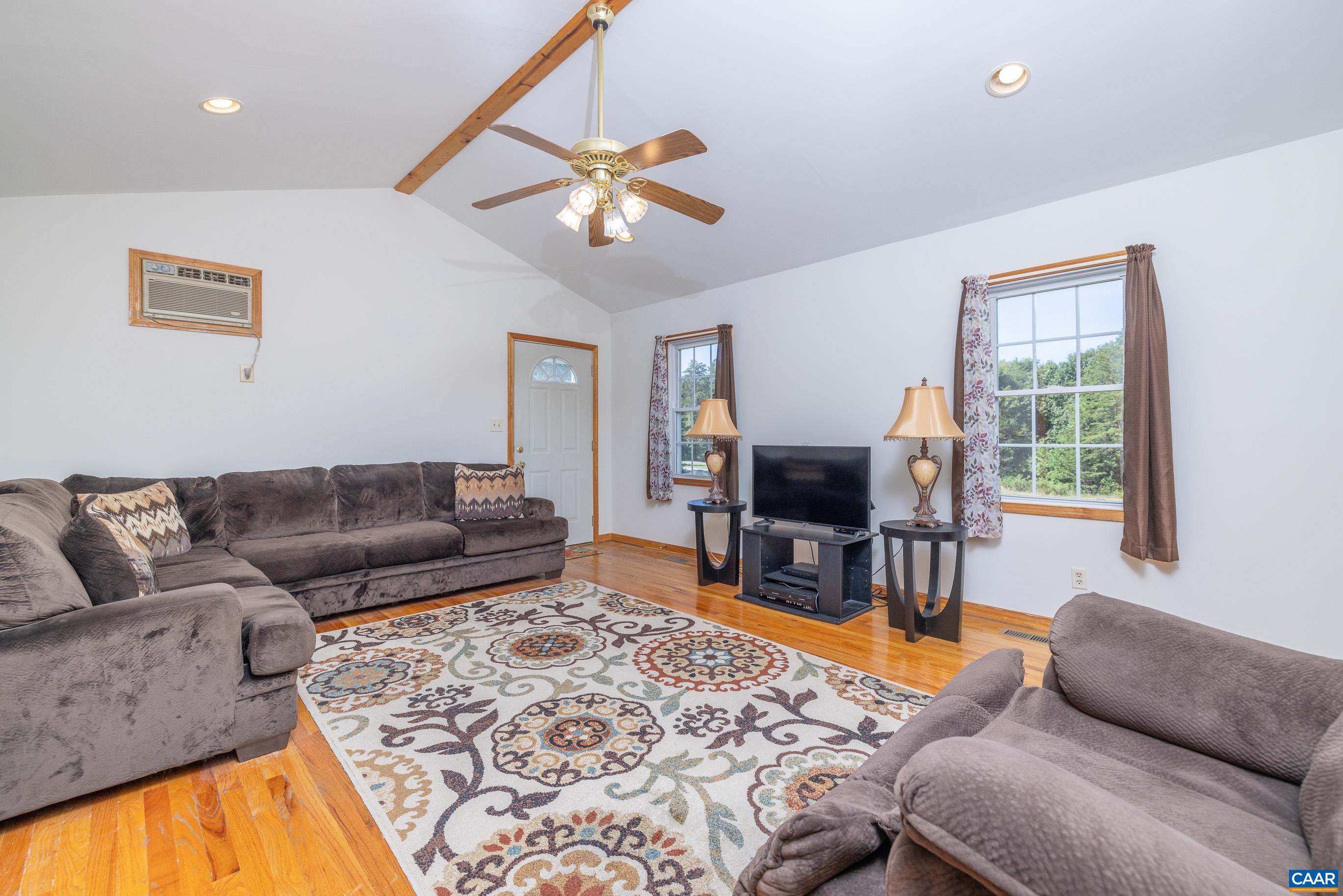 7839 Venable Road Kents Store, VA 23084 - Photo 32 of 51 a living room with furniture and a flat screen tv