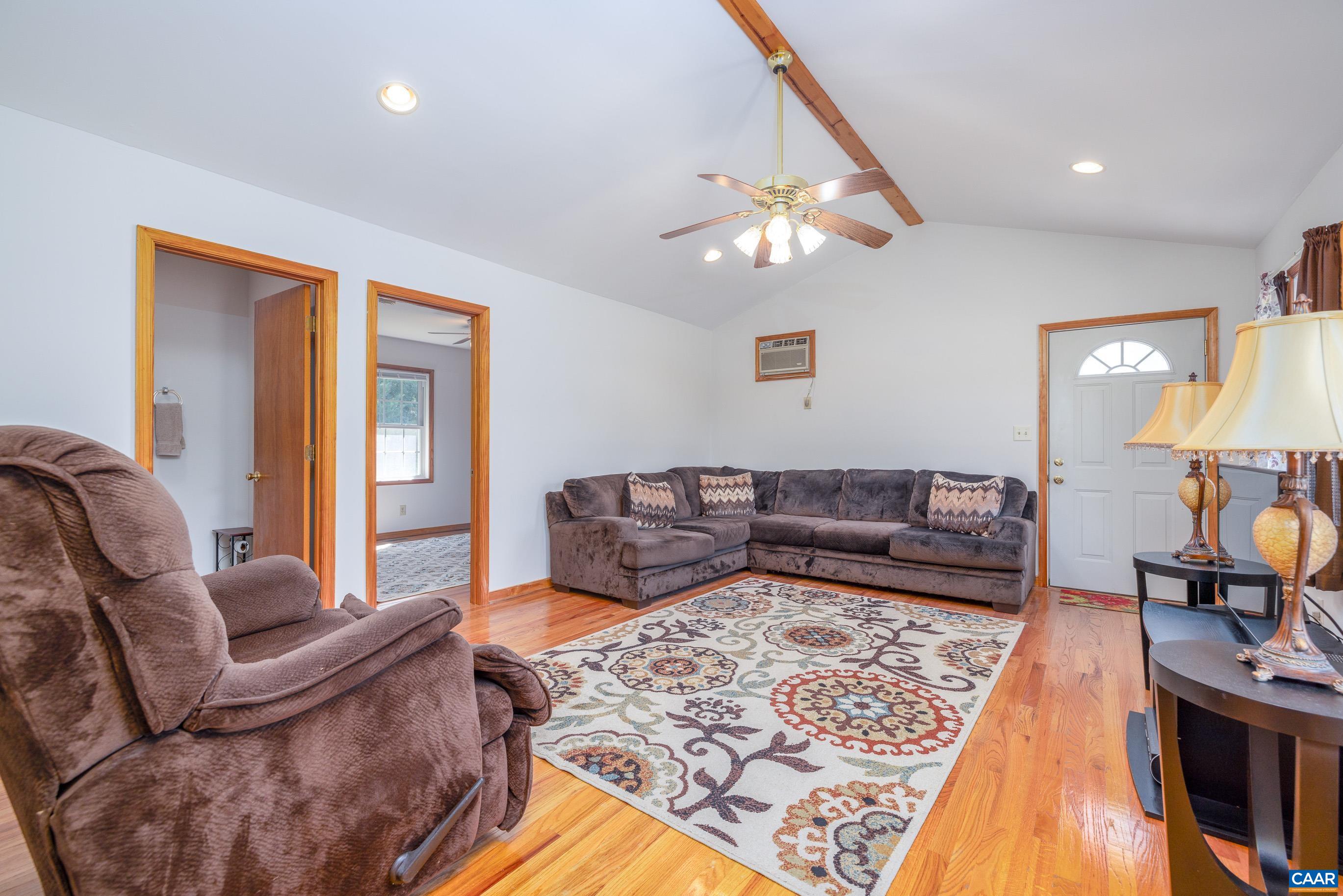 7839 Venable Road Kents Store, VA 23084 - Photo 33 of 51 a living room with furniture and a rug